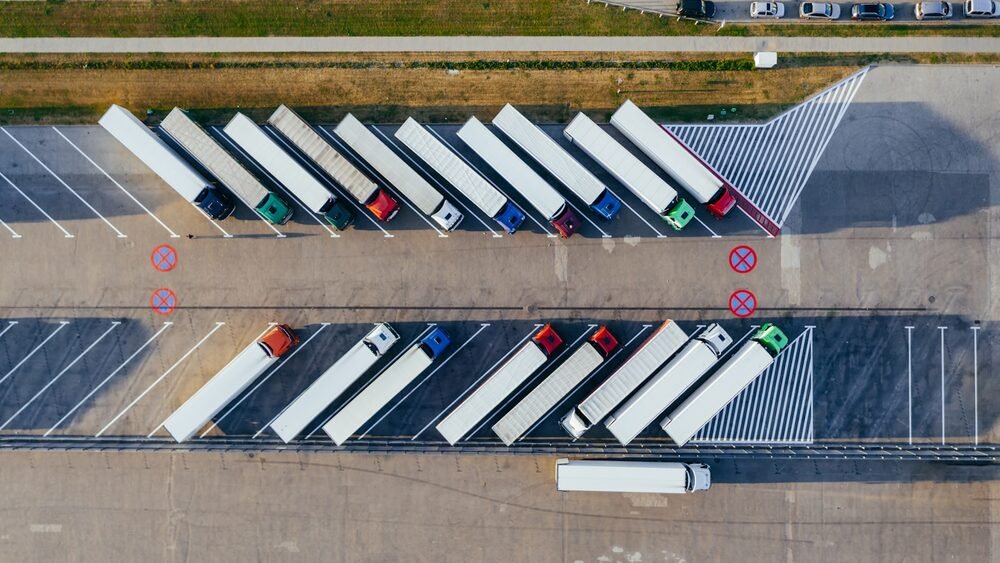 Aerial view of an industrial estate yard with trucks